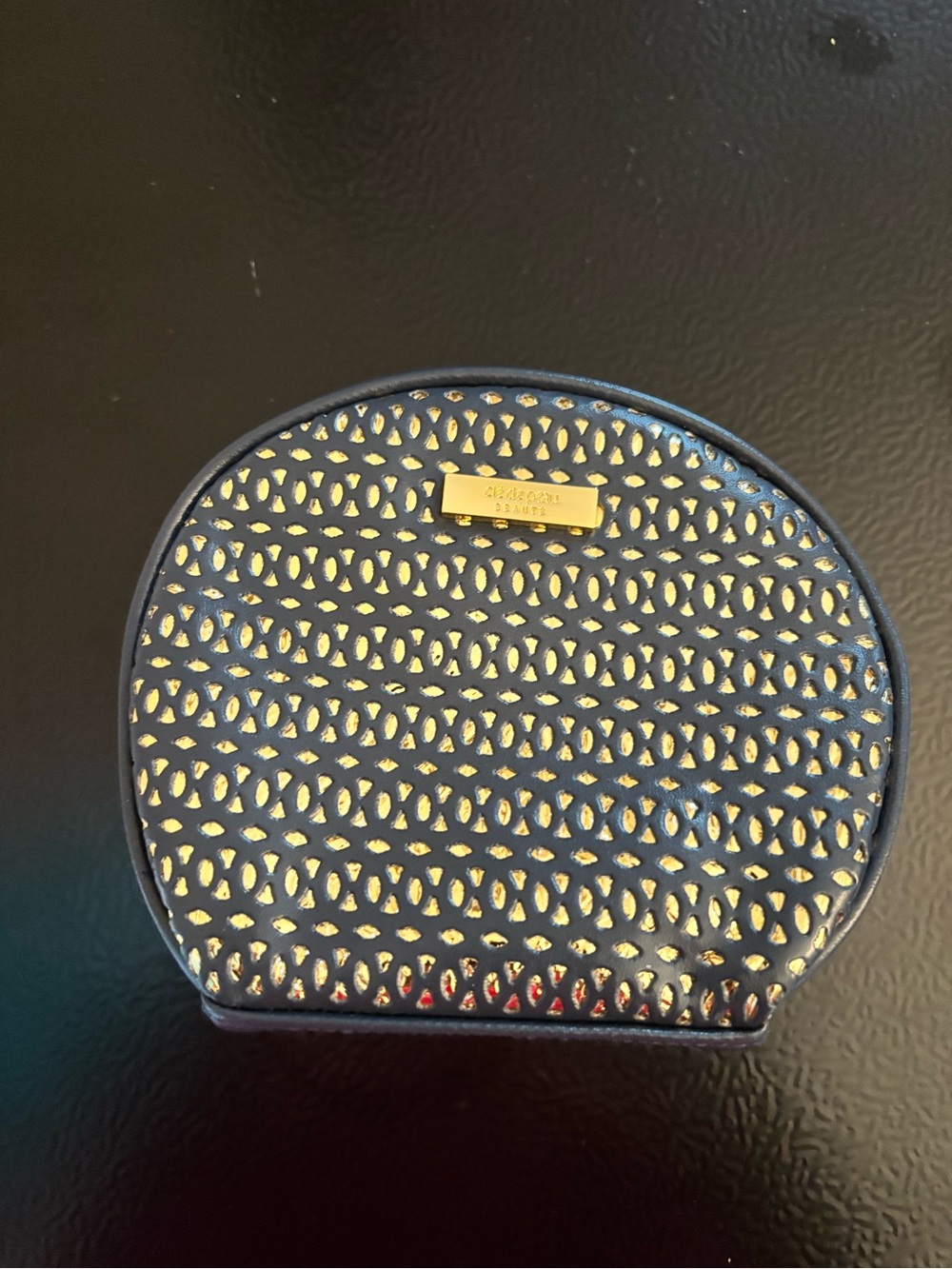 navy and gold make up bag. Please pick with another item